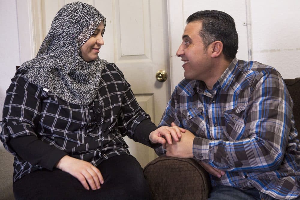 Zenab, left, and Zid Al-Nassar share a laugh in their Westfield home. (Jesse Costa/WBUR)