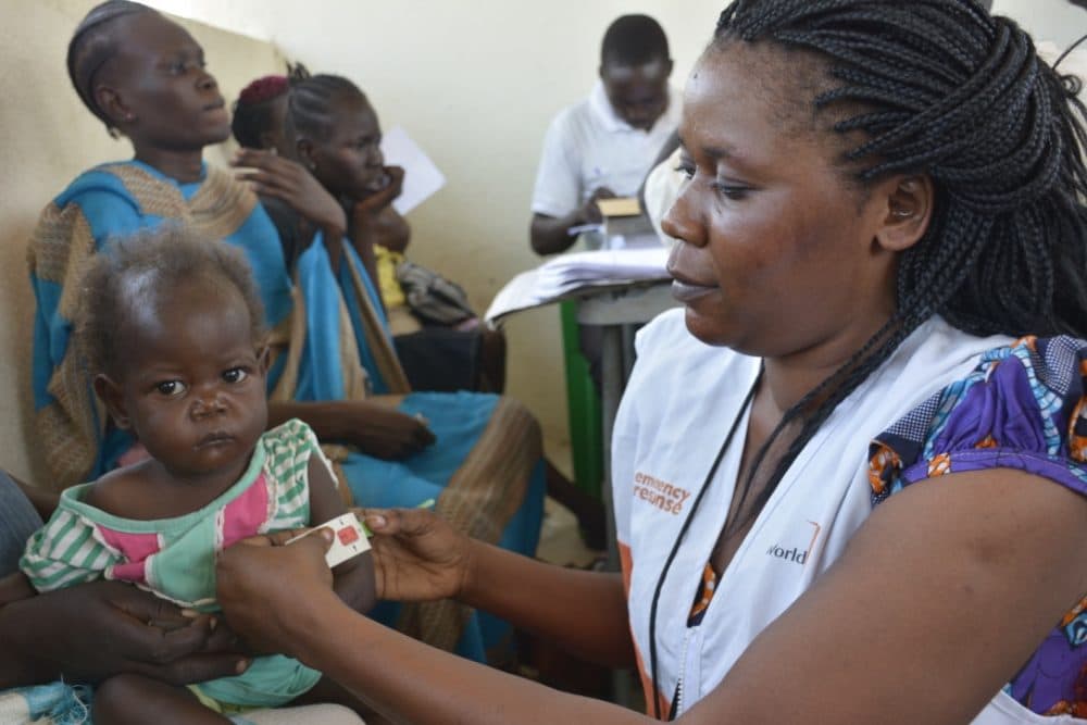 Children undergoing screening for malnutrition at one of the health facilities in Juba where World Vision has an outpatient therapeutic program for malnourished children. The red indicates severe acute malnutrition. (Courtesy Rose Ogola/World Vision)