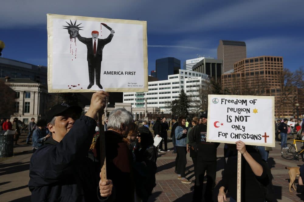Calling Trump &quot;chaotic&quot; and &quot;a pathological liar,&quot; influential publications around the world are advising their country's leaders to oppose him. Pictured: A man holds a sign depicting the cover of the German magazine Der Spiegel during a rally to protest President Donald Trump's executive order to temporarily ban some refugees from seven mostly Muslim countries, in Denver, Saturday, Feb. 4, 2017. (Brennan Linsley/AP)