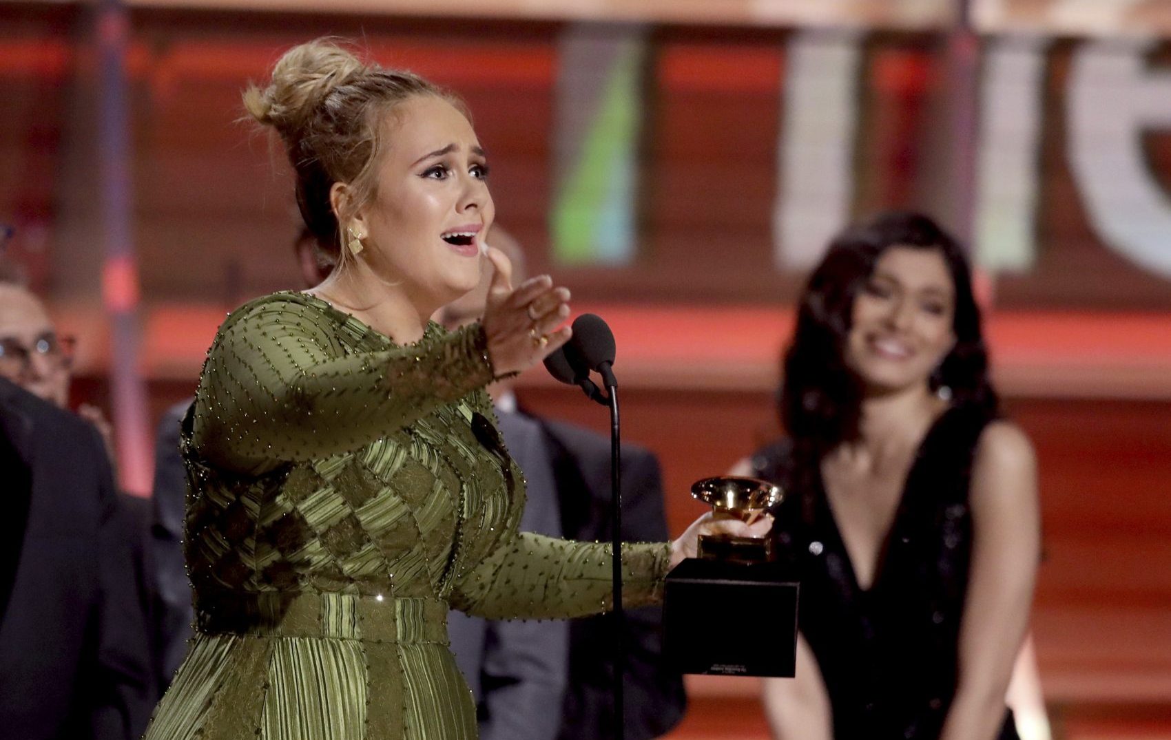 Adele accepts the award for Album of the Year for &quot;25&quot; at the Grammy Awards on Sunday. (Matt Sayles/Invision/AP)
