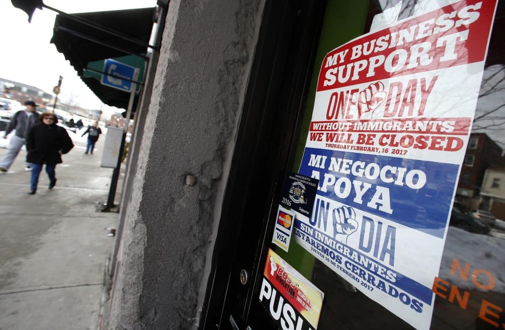 A sign in support of &quot;A Day Without Immigrants&quot; is displayed in a closed business in the East Boston neighborhood of Boston, Thursday, Feb. 16, 2017. Immigrants around the U.S. stayed home from work and school Thursday to demonstrate how important they are to America's economy and its way of life, and many businesses closed in solidarity, in a nationwide protest called A Day Without Immigrants. (AP Photo/Michael Dwyer)