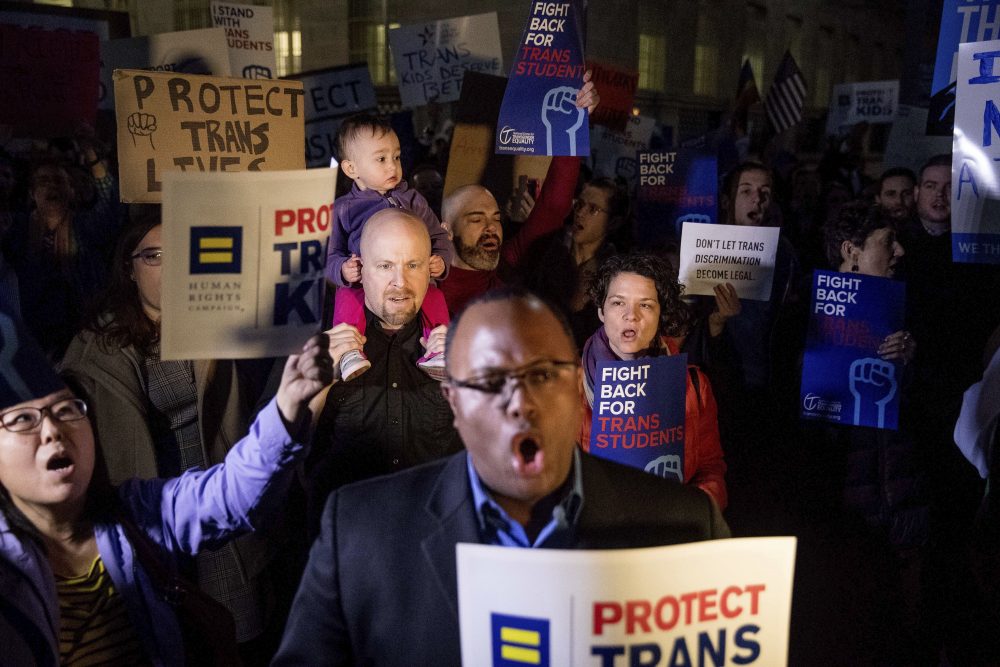 Activists and protesters with the National Center for Transgender Equality rally in front of the White House on Wednesday after the Department of Education and the Justice Department announce plans to overturn the school guidance on protecting transgender students. (Andrew Harnik/AP)