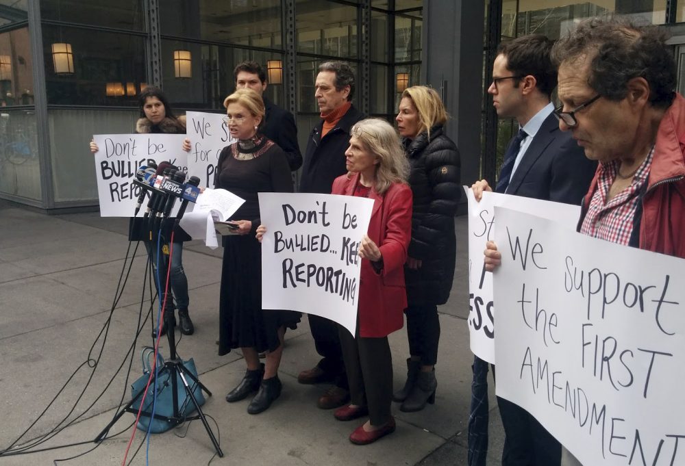 Beleaguered reporters should not boycott press briefings, satisfying as it may feel, because it doesn't serve the public, writes Susan E. Reed. Pictured: Rep. Carolyn Maloney, D-NY, foreground left, addresses the media in front of the New York Times offices, Saturday, Feb. 25, 2017 in New York. Maloney voiced outrage over the White House decision to block The New York Times, the Los Angeles Times, CNN, Politico and others from a press briefing in Washington on Feb. 24. Maloney wants the Trump administration to commit to a policy of press access for all. (Julie Walker/AP)