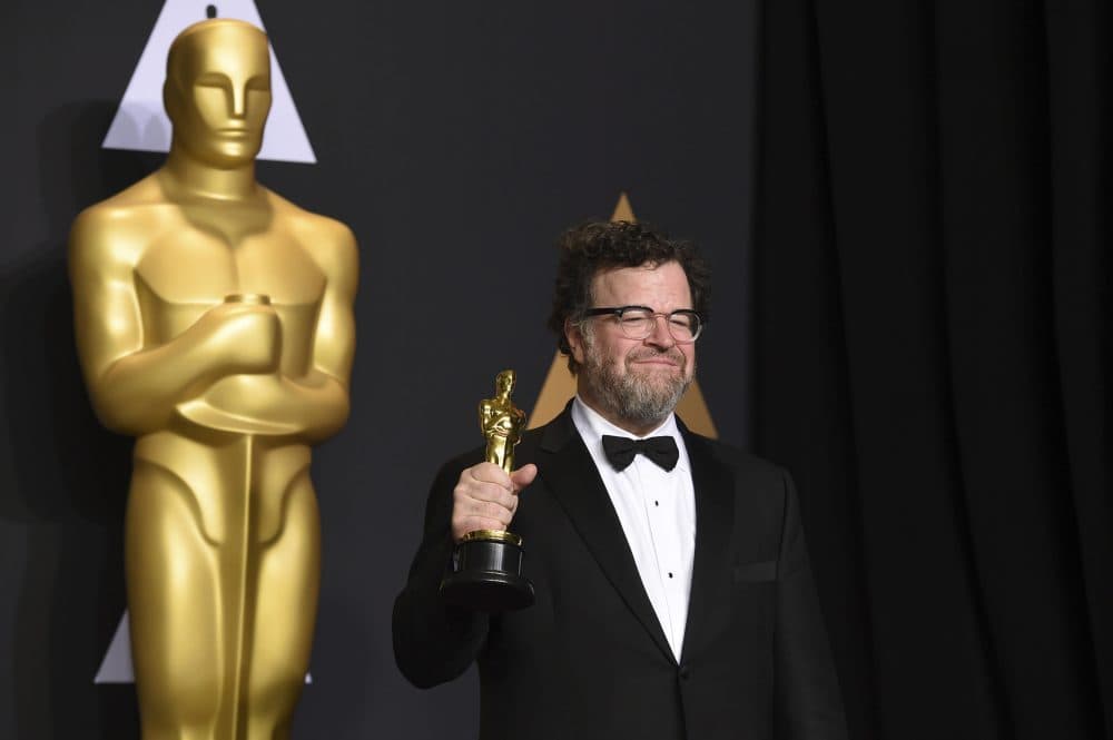 Kenneth Lonergan poses in the press room with the award for best original screenplay for &quot;Manchester by the Sea&quot; at the Oscars on Sunday in Los Angeles. (Jordan Strauss/Invision/AP)