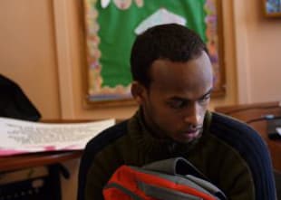 Amin Abdi spent eight years in a refugee camp before coming to the U.S. (Max Larkin/WBUR)