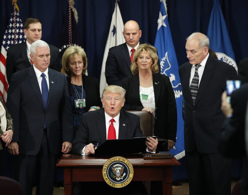 International leaders are taking Trump seriously, writes Susan E. Reed. This time, he has to stay in his lane. Pictured: President Donald Trump, accompanied by Vice President Mike Pence, Homeland Security Secretary John F. Kelly, and others, during a visit to the Homeland Security Department on Wednesday, Jan. 25. (Pablo Martinez Monsivais/AP)