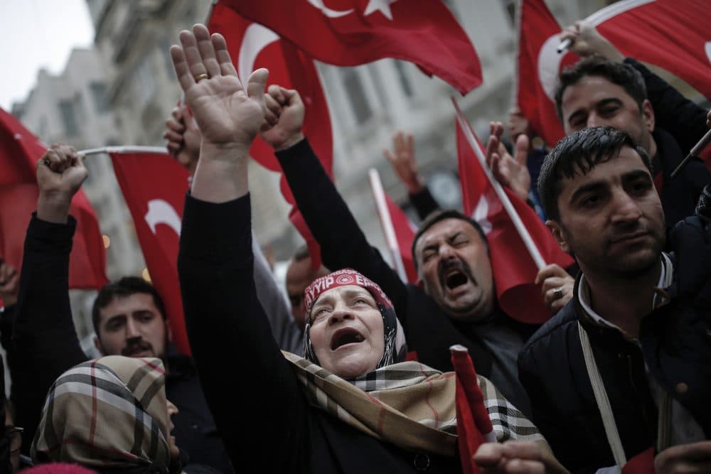 A group of Turks protest outside the Dutch consulate in Istanbul, Sunday, March 12, 2017. Turkish President Recep Tayyip Erdogan says he appropriately accused the Dutch government of &quot;Nazism and fascism,&quot; saying only those types of regimes would bar foreign ministers from traveling within their countries. Erdogan also said during a live televised address on Sunday that the Netherlands would &quot;pay the price&quot; for sacrificing its ties with a NATO ally to upcoming elections there. (Emrah Gurel/AP)