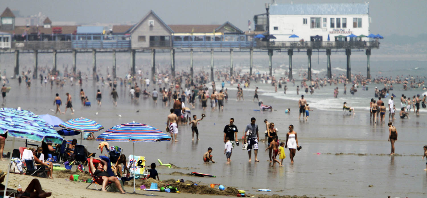Beach enthusiasts cool off in the ocean at Old Orchard Beach in Maine. (Pat Wellenbach/AP)