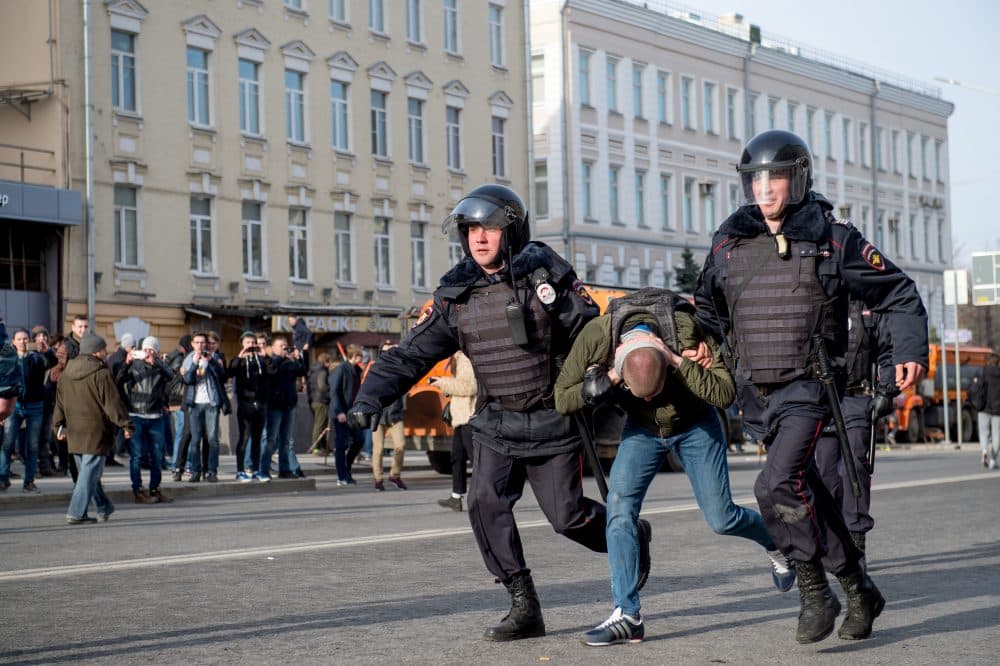 Riot police officers detain a protester during an unauthorized anti-corruption rally in central Moscow on March 26, 2017. Thousands of Russians demonstrated across the country on March 26 to protest at corruption, defying bans on rallies which were called by prominent Kremlin critic Alexei Navalny -- who was arrested along with scores of others. (Alexander Utkin/AFP/Getty Images)