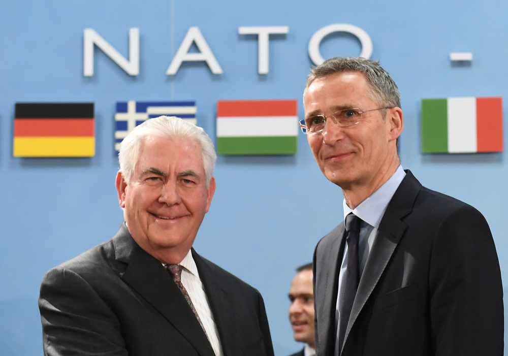NATO Secretary General Jens Stoltenberg (right) greets Secretary of State Rex Tillerson upon his arrival for a North Atlantic Council (NAC) meeting at the level of Foreign Ministers, at NATO headquarters in Brussels on March 31, 2017. (Emmanuel Dunand/AFP/Getty Images)