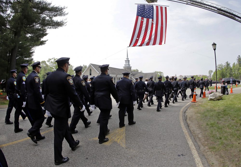 Police march to St. Joseph's Church during the funeral for Auburn Police Officer Ronald Tarentino Jr., Friday, May 27, 2016, in Charlton, Mass. (AP Photo/Elise Amendola)