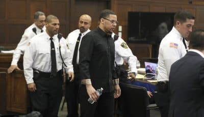 Alexander Bradley enters the courtroom Tuesday for his second day of testimony during Aaron Hernandez' double murder trial in Suffolk Superior Court. (Pat Greenhouse /The Boston Globe via AP, Pool)