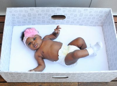 For 80 years, writes Kate Mitchell, the Finnish government has given new parents cardboard boxes that double as infant beds. (Photo courtesy of The Baby Box Co.)