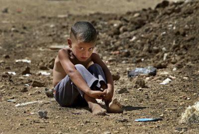 Their myriad stories are deeply human and rarely simple, writes C. Nicholas Cuneo. Pictured: A Syrian refugee boy sits on the ground at a temporary refugee camp, in the eastern Lebanese town of Al-Faour, Bekaa valley near the Syria-Lebanon border. (Hussein Malla/AP)