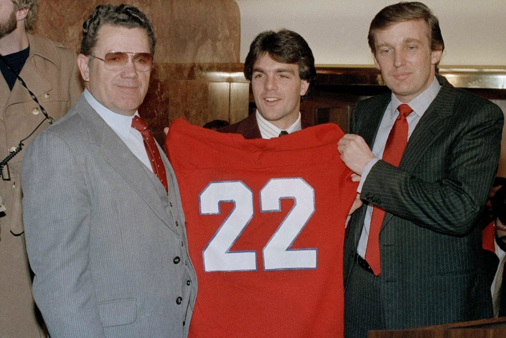 It's tempting to see the FBI's investigation of Trump's Russia ties as his Spygate, writes Steve Almond. But that doesn't capture the enormity of what's at stake. Pictured: Boston College quarterback Doug Flutie poses with New Jersey Generals head coach Walt Michaels, left, and General's owner, Donald Trump, at a news conference in New York, Feb. 5, 1985. An official announcement was made that Flutie signed a multi-million-dollar pact with the USFL team. (Marty Lederhandler/AP)