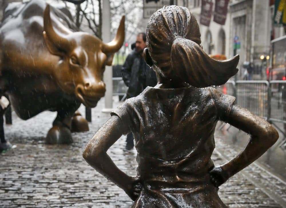 The &quot;Fearless Girl&quot; statue opposite the &quot;Charging Bull&quot; statue in New York is part of an effort to the need for more women on corporate boards. Funded by Boston-based State Street Global Advisors, an inscription at the base reads, &quot;Know the power of women in leadership. She makes a difference.&quot; (Bebeto Matthews/AP)