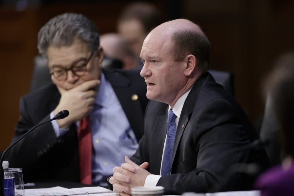 Democratic members of the Senate Judiciary Committee, Sen. Chris Coons, D-Del., center, and Sen. Al Franken, D-Minn., left, question the Republican side as the panel meets to advance the nomination of President Trump's Supreme Court nominee Neil Gorsuch. (J. Scott Applewhite/AP)