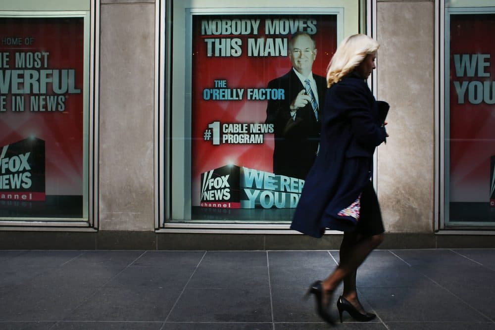 An advertisement for Bill O'Reilly's top-rated Fox News show is displayed in the window of the News Corporation headquarters on April 5, 2017 in New York. (Spencer Platt/Getty Images)