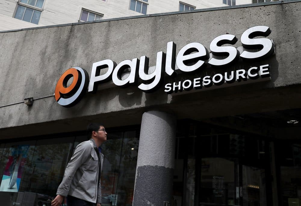 A pedestrian walks by a Payless Shoe Source store on April 5, 2017 in San Francisco. The Kansas-based discount shoe retailer has filed for Chapter 11 bankruptcy and will close nearly 400 of its stores. (Justin Sullivan/Getty Images)