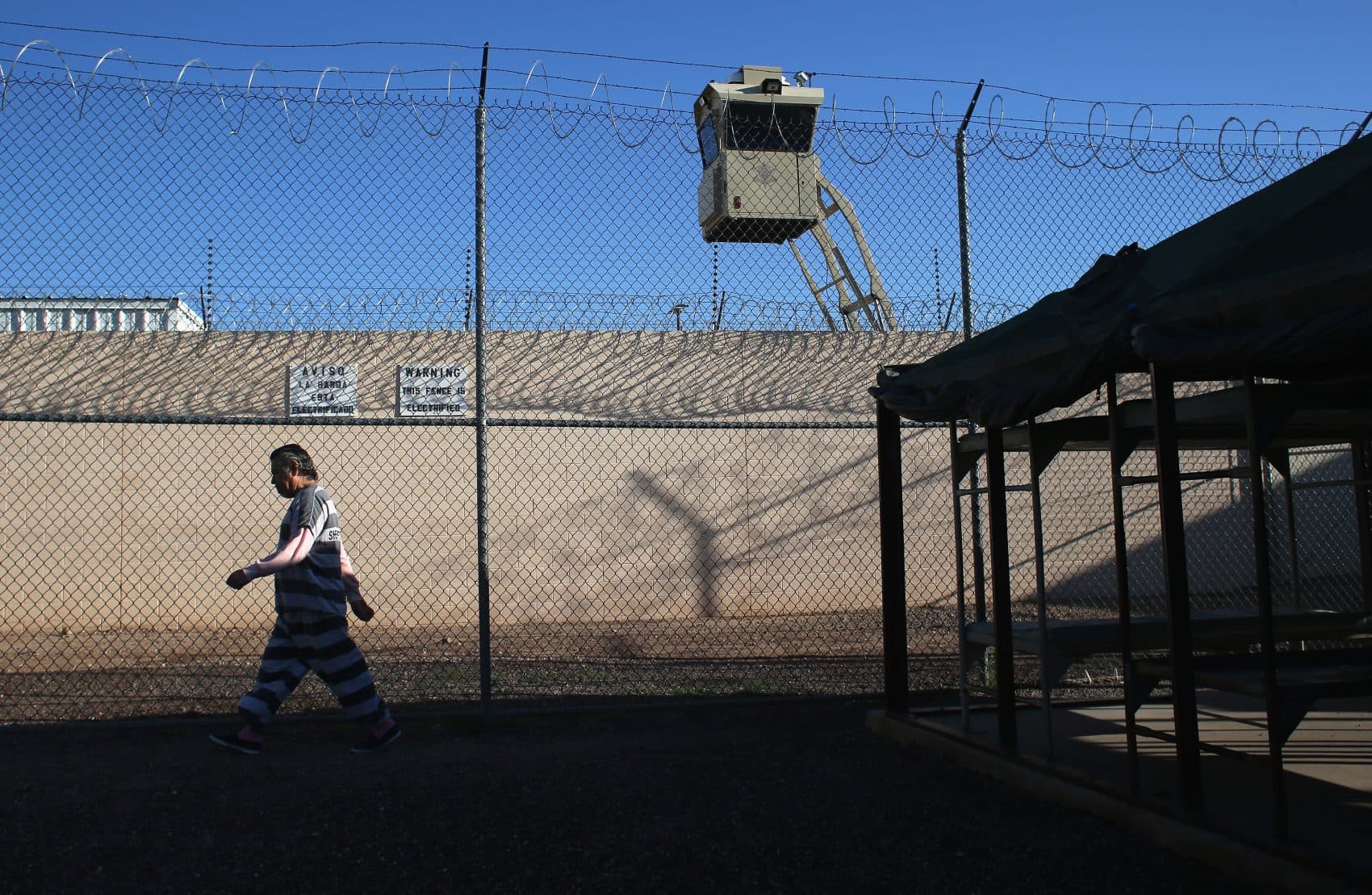 An immigrant inmate walks for exercise at the Maricopa County Tent City jail on March 11, 2013, in Phoenix. (John Moore/Getty Images)