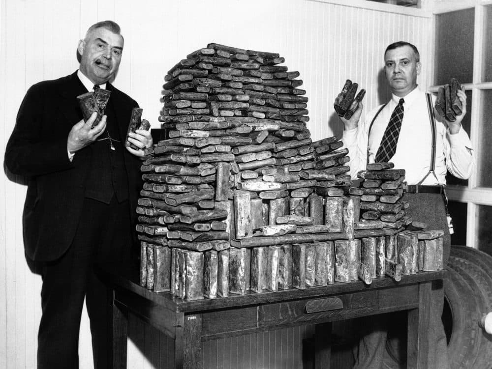 Agents Chris Hansen and H.A. Moodie hold seized opium in Los Angeles on April 22, 1935. Ingeniously hidden under a load of oranges in the rear of an auto driven by a Chinese man, this store of opium, valued at $40,000, was seized by federal narcotic officers. The driver was arrested. (AP)