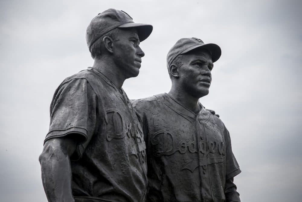 A statue of Jackie Robinson (right) and teammate Pee Wee Reese (left) stands in Brooklyn. According to Dr. Chris Stride, there are more statues for Jackie Robinson than any other U.S. athlete. (Andrew Burton/Getty Images)