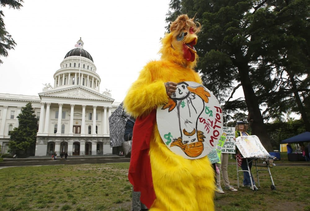 Dressed as the &quot;Real Chicken Don&quot; Shawn Frye joins others in calling for President Donald Trump to release his tax returns, Wednesday, April 12, 2017, at the Capitol in Sacramento, Calif. Tax March Sacramento activists are planning to join others in a protest on Tax Day, April 15 calling on the the president to release his tax returns. (Rich Pedroncelli/AP)