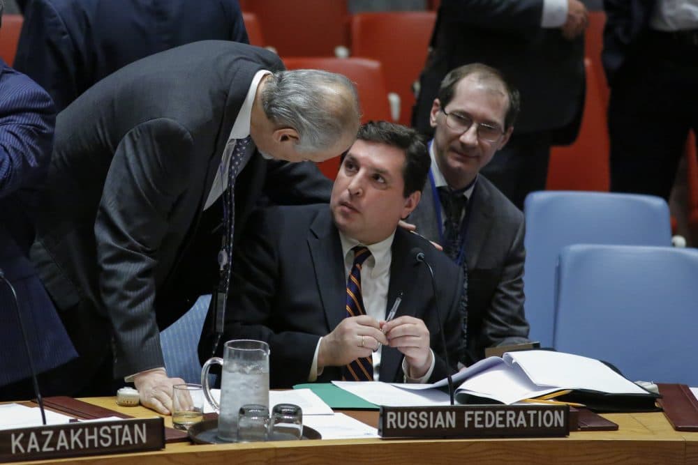 Russian Deputy Permanent Representative to the U.N. Vladimir Safronkov (right) speaks with Syrian Ambassador to the U.N. Bashar Jaafari (left) before they attend a meeting to vote on a Draft resolution that condemns the reported use of chemical weapons in Syria at the Security Council on April 12, 2017. (Kena Betancur/AFP/Getty Images)