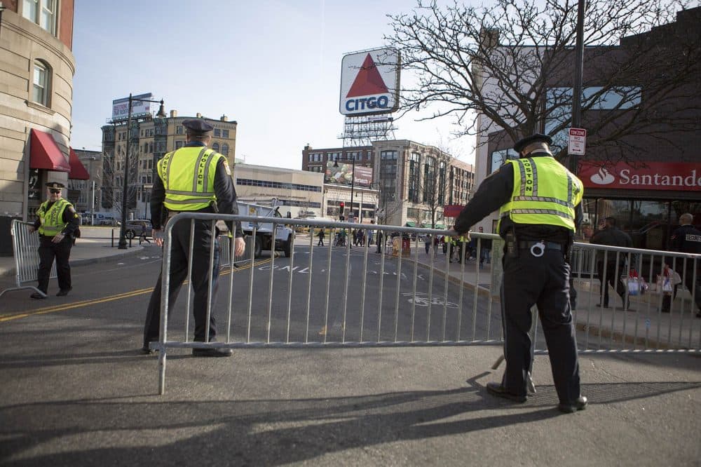 Police set up a barricade on Brookline Avenue in Kenmore Square before the 2016 Boston Marathon. (Jesse Costa/WBUR)