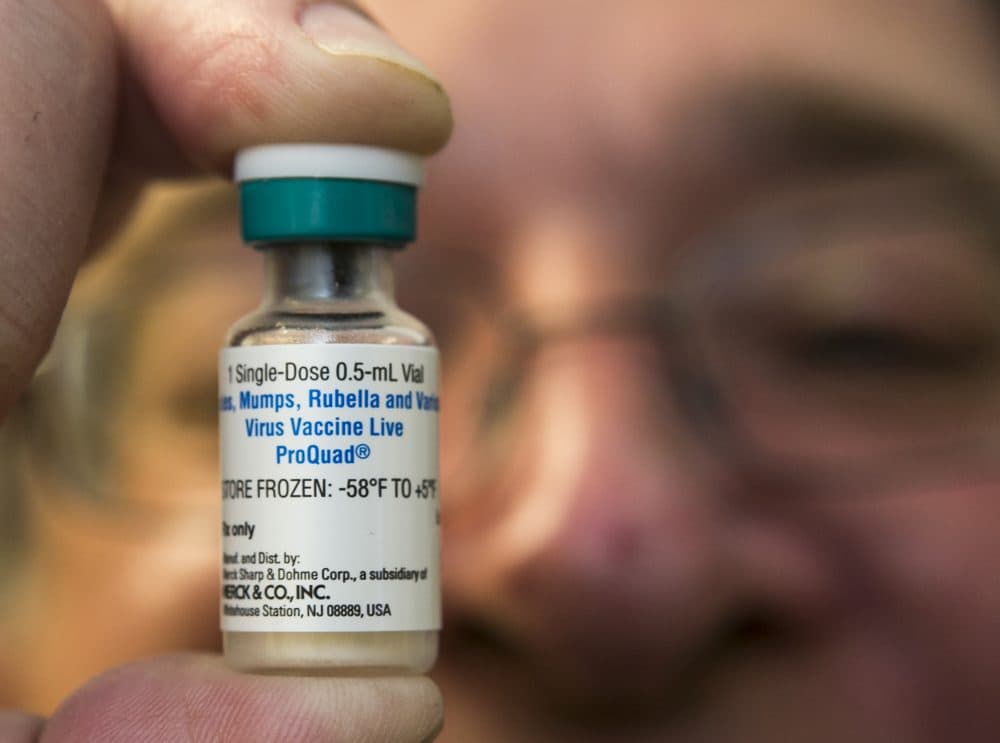 In this Thursday, Jan. 29, 2015 file photo, a pediatrician holds a dose of the measles-mumps-rubella (MMR) vaccine at his practice in Northridge, Calif. (Damian Dovarganes/AP)