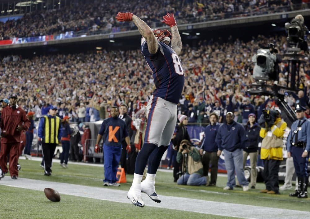 Patriots tight end Aaron Hernandez celebrates his touchdown catch against the Texans on Dec. 10, 2012. (Elise Amendola/AP)