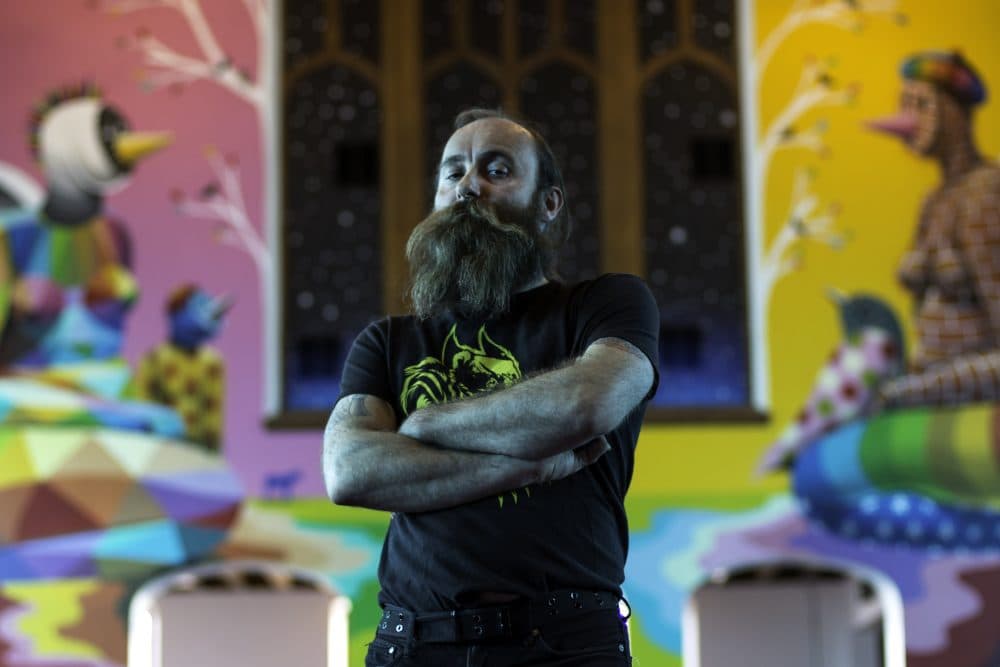 Co-founder Lee Molloy stands in the chapel of the International Church of Cannabis. The building is a former church found on Logan Street in Denver. (Corey Jones/CPR News)