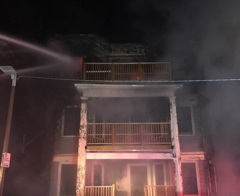 An early morning fire in Dorchester Sunday damaged four triple decker homes and displaced 17 residents. (Courtesy Boston Fire Department)