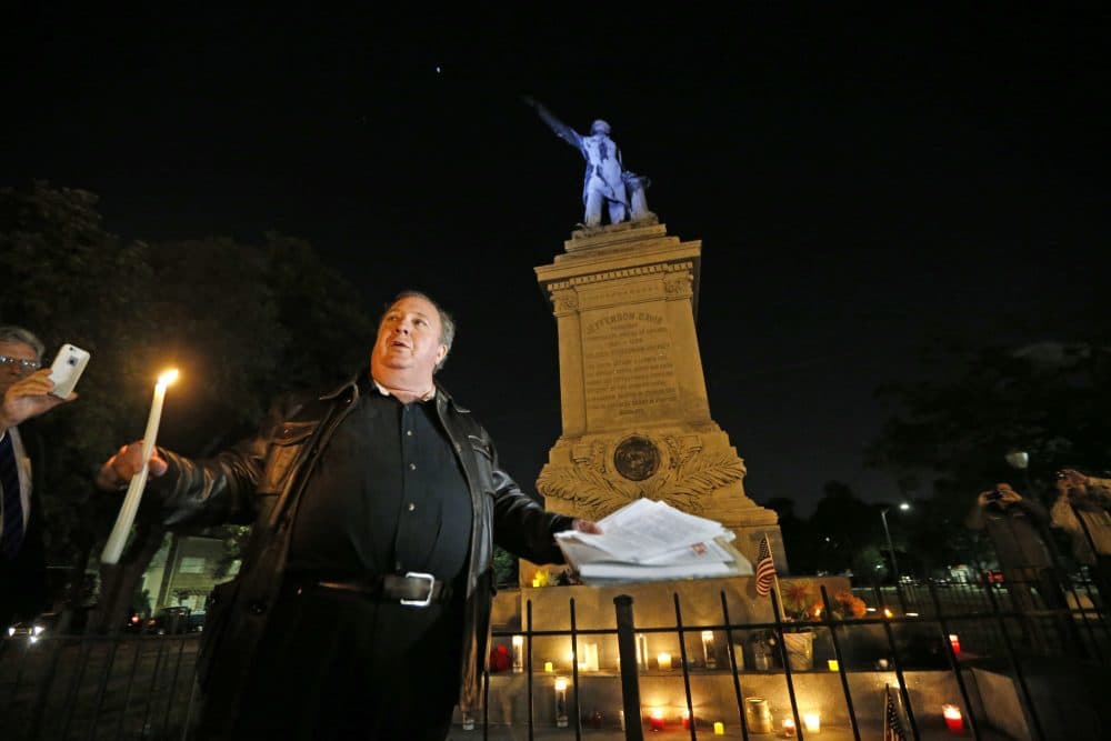 Charles Lincoln speaks during a candlelight vigil at the statue of Jefferson Davis in New Orleans, Monday, April 24, 2017. New Orleans is taking down Confederate statutes, becoming the latest Southern body to divorce itself from what some say are symbols of racism and intolerance. (Gerald Herbert/AP)