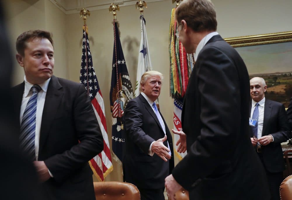President Trump greets Wendell P. Weeks, right, chief executive officer of Corning, as he hosts breakfast with business leaders in the Roosevelt Room of the White House in Washington, Monday, Jan. 23, 2017. On the left is Elon Musk, CEO of SpaceX and Tesla Motors. (Pablo Martinez Monsivais/AP)