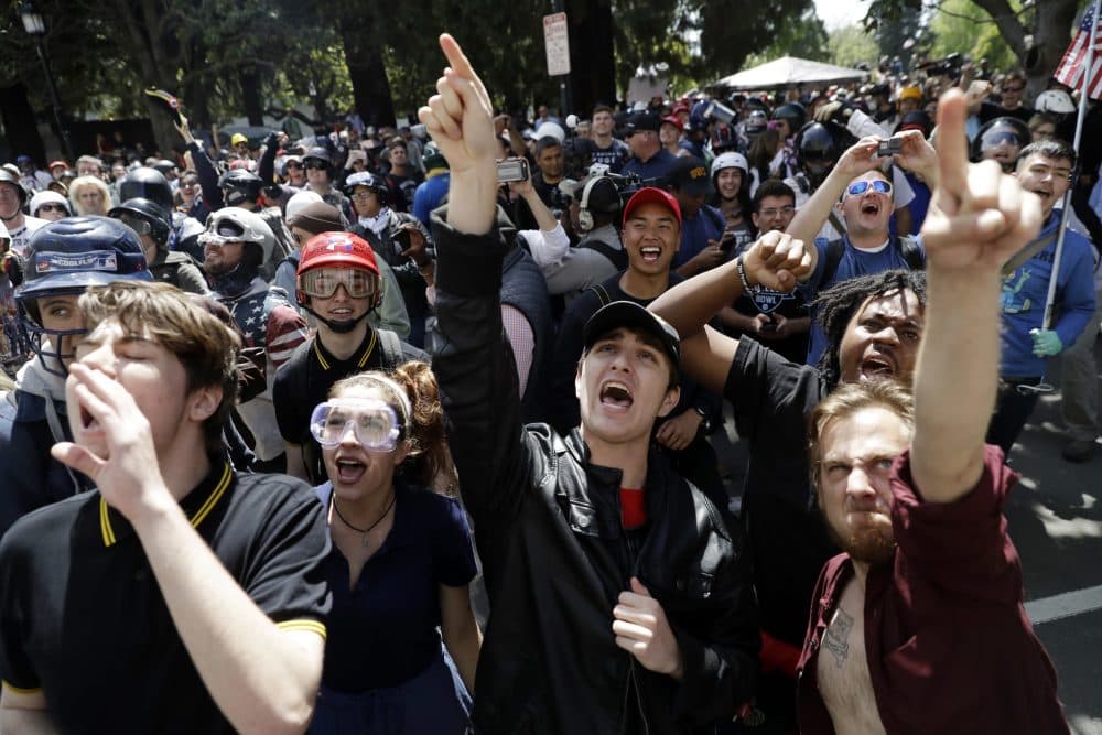 Demonstrators shout slogans directed at city hall during a rally for free speech Thursday, April 27, 2017, in Berkeley, Calif. (Marcio Jose Sanchez/AP)