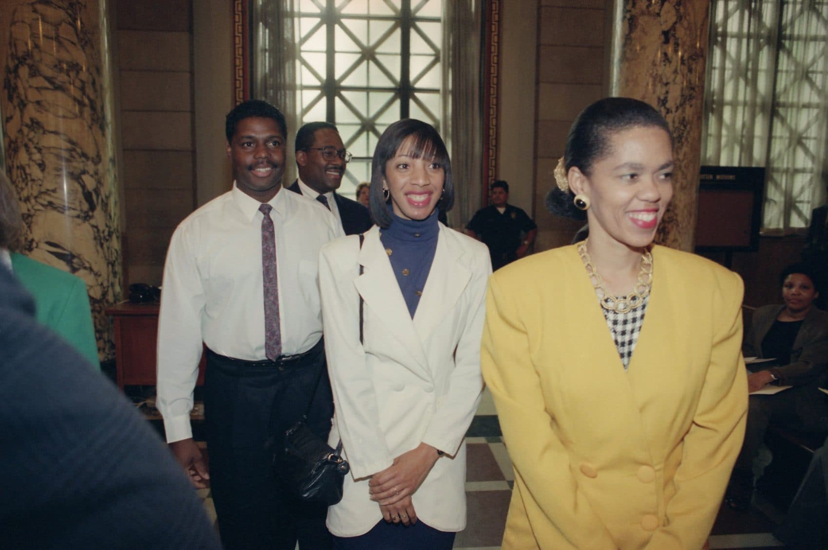 Four Los Angeles residents who rescued truck driver Reginald Denny from his rig after he was beaten during the first night of rioting were awarded a heroes' welcome at Los Angeles City Council, May 5, 1992. From right to back are Lei Yuille, Terri Barnett, Titus Murphy and Gregory Alan Williams. (Bob Galbraith/AP)