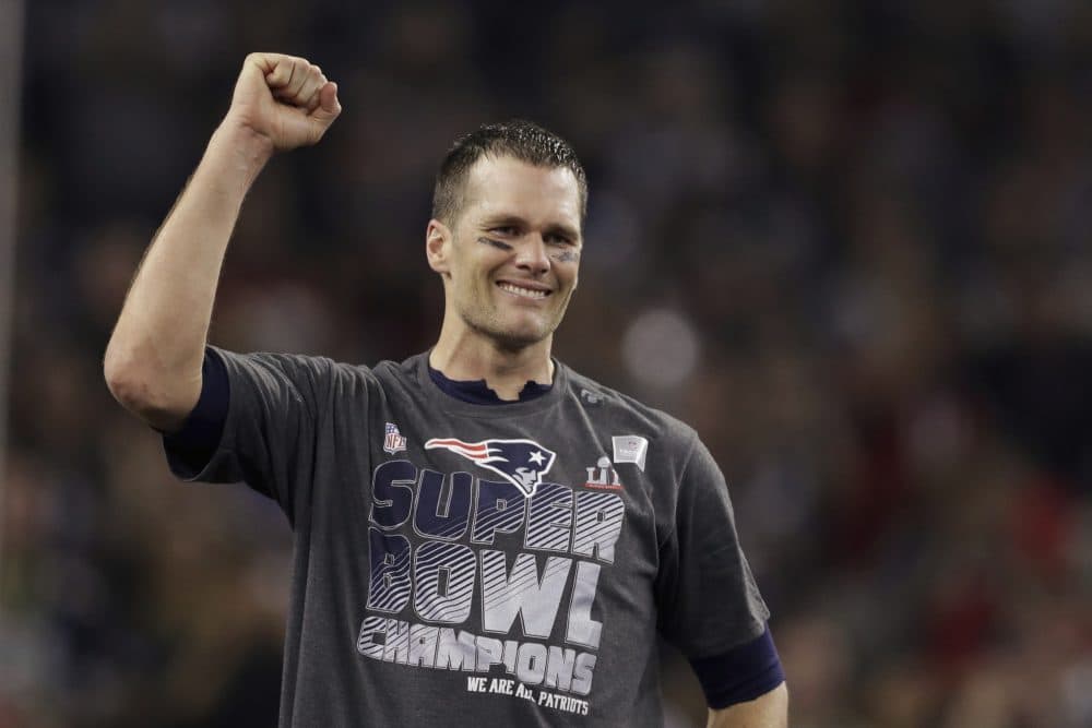 Tom Brady raises his fist after his team's recent Super Bowl win. (Darron Cummings/AP)