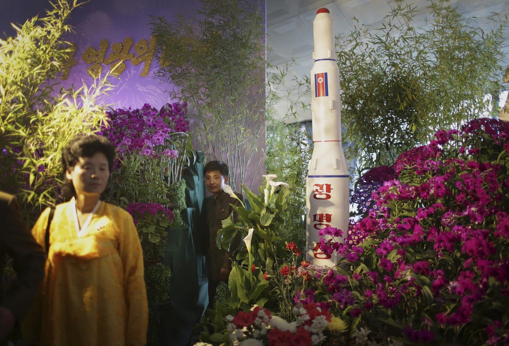 North Koreans walk past a model of a rocket at a flower festival as part of celebrations to mark the 105th birth anniversary of late leader Kim Il Sung on Sunday, April 16, 2017, in Pyongyang, North Korea. A North Korean missile exploded during launch Sunday, U.S. and South Korean officials said, a high-profile failure that comes as a powerful U.S. aircraft supercarrier approaches the Korean Peninsula in a show of force. (Wong Maye-E/AP)