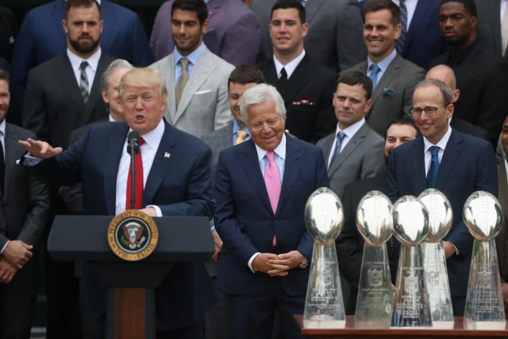 Patriots owner Robert Kraft, center, and others listen as President Trump speaks during a ceremony on the South Lawn of the White House on Wednesday. (Andrew Harnik/AP)