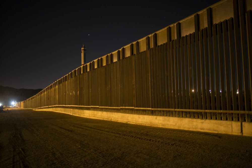 Even if you believe good fences make good neighbors, writes Rich Barlow, $21 billion is a lot to drop on an undocumented-immigrant problem that candidate Trump exaggerated. Pictured: A portion of the new steel border fence stretches along the U.S.-Mexico border in Sunland Park, New Mexico, Thursday, March 30, 2017. This fencing just west of the New Mexico state line was planned and started before President Donald Trump's election, adding to the 650 miles of fences, walls and vehicle barriers that already exist along the nearly 2,000-mile frontier. (Rodrigo Abd/AP)