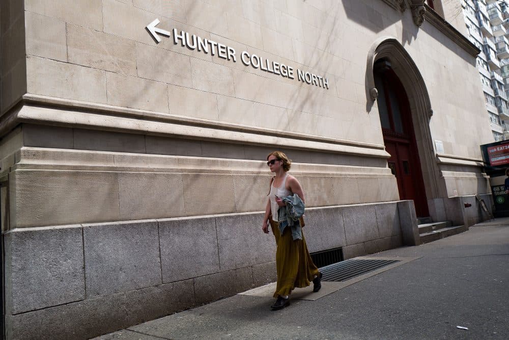 A woman walks along 68th Street on the campus of Hunter College of The City University of New York, April 10, 2017 in New York City. Following a state budget approval on Sunday, New York will be the first state to make public colleges and universities free for qualified middle-class students with a family income under $125,000. (Drew Angerer/Getty Images)
