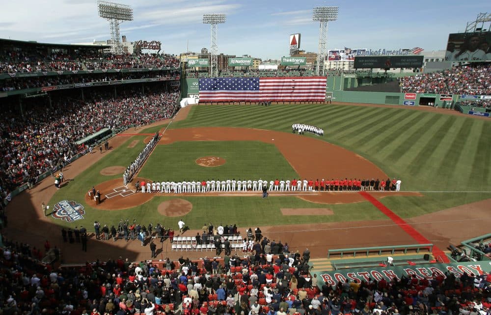 The Pittsburgh Pirates, left, and Boston Red Sox stand along the baselines before their opening day baseball game at Fenway Park, Monday, April 3, 2017, in Boston. (Steven Senne/AP)