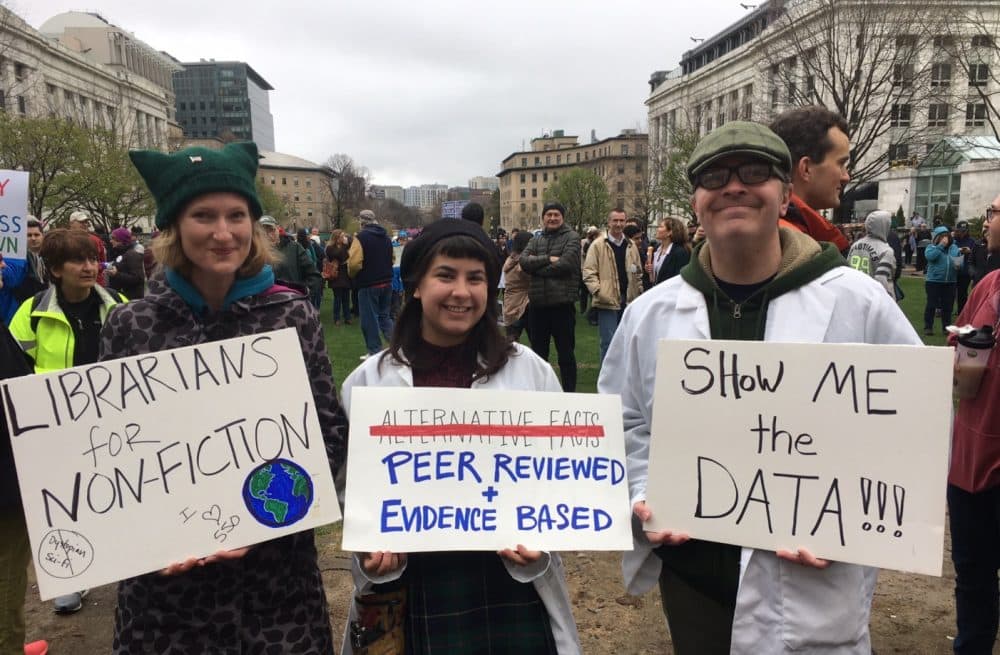 At Harvard Medical School before Boston's &quot;March for Science,&quot; Librarian Andrea Fiorillo, illustrator Anna Lensch and Harvard Medical School chief of staff Willy Lensch. (Carey Goldberg/WBUR)  