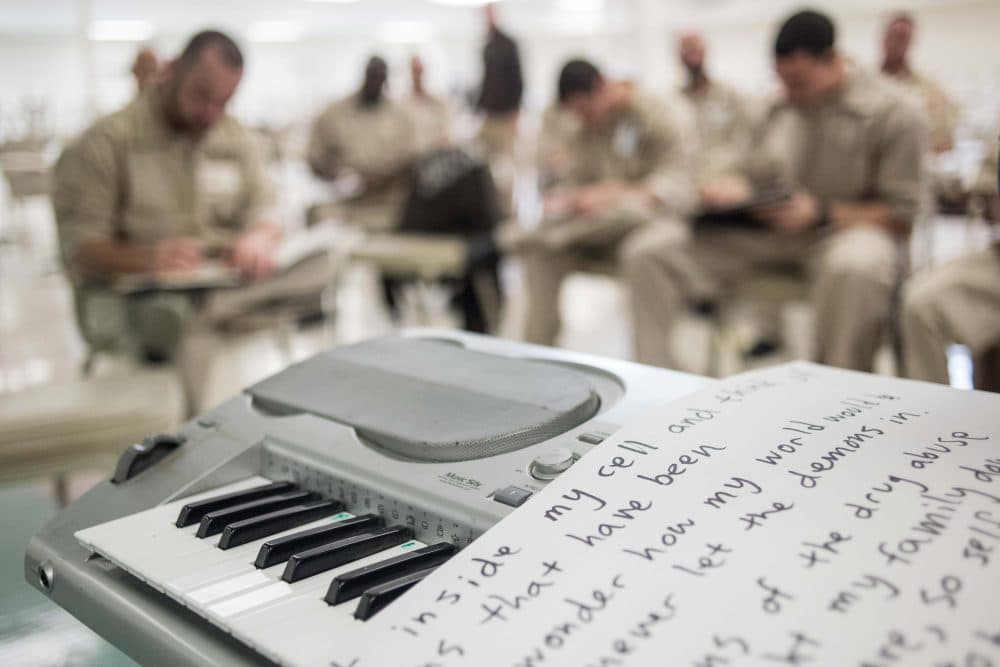 What emerging writers need most is not motivation but access, writes Eve Bridburg, and the NEA’s role in this effort is crucial. Pictured: Inmates participate in a lyric writing exercise during a music workshop at the Lee Correctional Institution in Bishopville, S.C. in 2016. (Sean Rayford/AP)