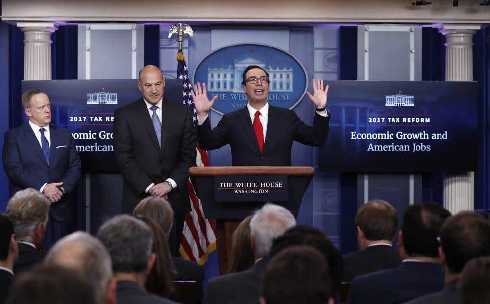 Treasury Secretary Steven Mnuchin, center, joined by National Economic Director Gary Cohn and White House press secretary Sean Spicer in the briefing room of the White House. (Carolyn Kaster/AP)