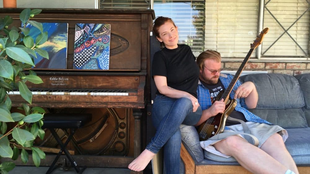 Blues musician and producer Kid Andersen and his wife, singer Lisa Leuschner, hang out on the porch outside their home in San Jose, California. (Rachael Myrow/KQED)