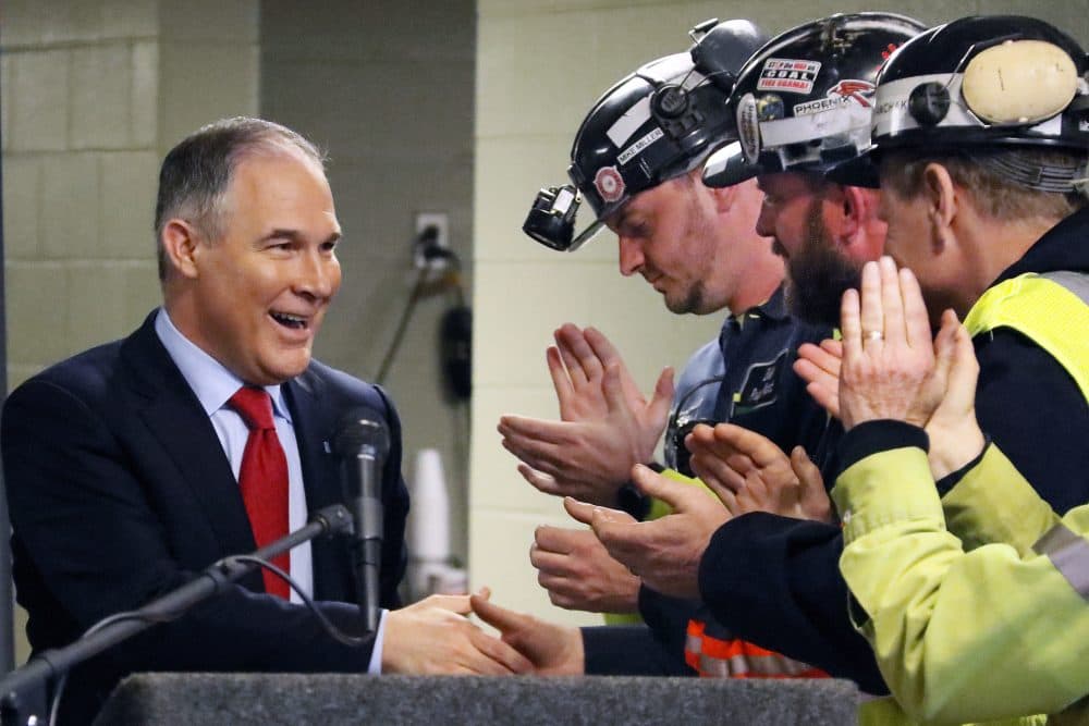 Environmental Protection Agency (EPA) Administrator Scott Pruitt, left, shakes hands with coal miners during a visit to Consol Pennsylvania Coal Company's Harvey Mine in Sycamore, Pa., in April. (Gene J. Puskar/AP)