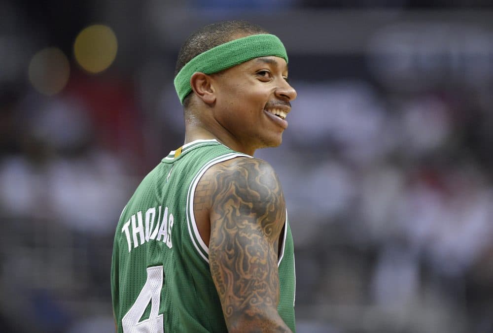 Celtics guard Isaiah Thomas smiles during the first half of Game 4 against the Wizards on Sunday in Washington. (Nick Wass/AP)