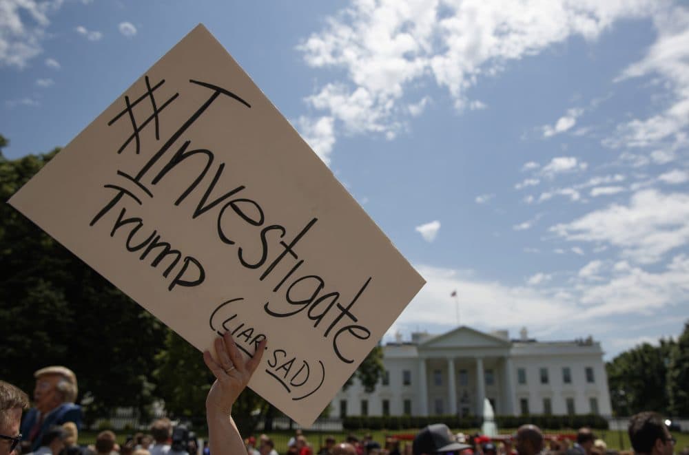 Demonstrators gather outside the White House a day after President Donald Trump fired FBI Director James Comey on Wednesday in Washington. (Evan Vucci/AP)